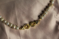 Front tie pearl necklace