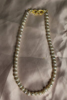 Front tie pearl necklace